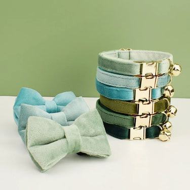 Six KittyNook Cat Co. Velvet Cat Collars with gold buckles and bells, plus three bow ties—luxuriously soft fit.
